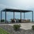 Ogrodowa pergola 580 x 400 x 250 cm aluminiowa L czarna, manualny dach, oświetlenie LED